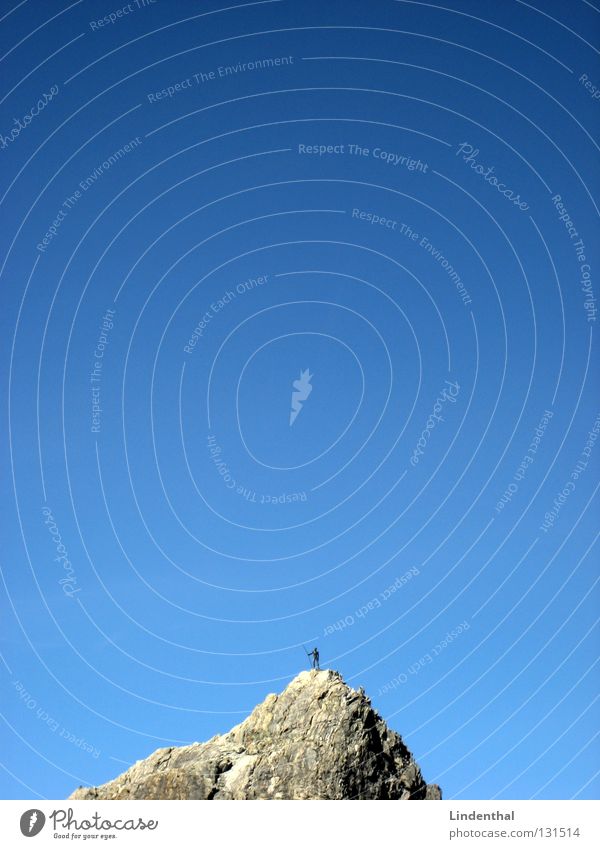 Dwarf on a mountain Sky Progress Mountaineer Man Stone Monument Blue Intersection little man mountain rescue Rock