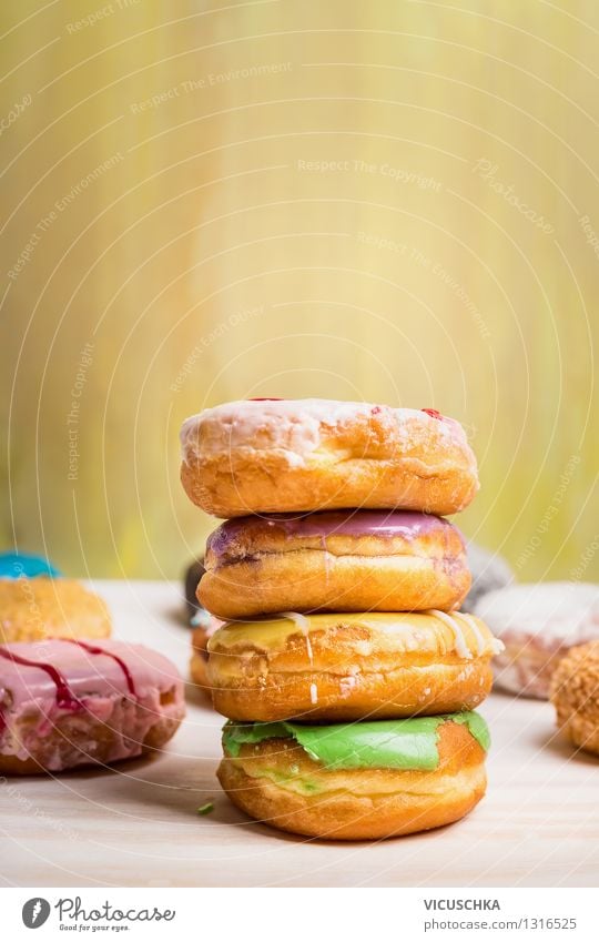 Freshly baked donuts with glaze Food Dough Baked goods Cake Dessert Nutrition Breakfast Diet Style Design Table Yellow Pink Snack Donut Sweet Dish Stack