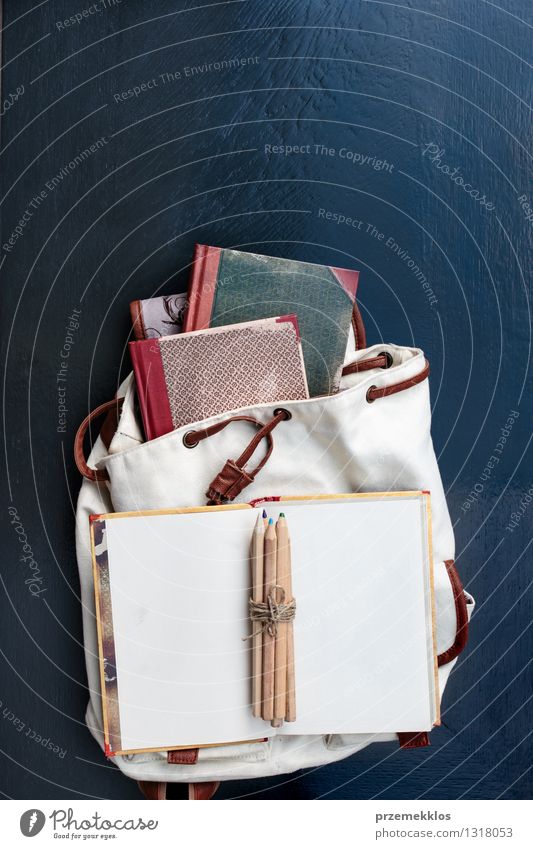 Notebooks pencils and school bag on a desktop Table School Study Book Accessory Education Backpack Crayon notebook Pencil Colour photo Interior shot Close-up