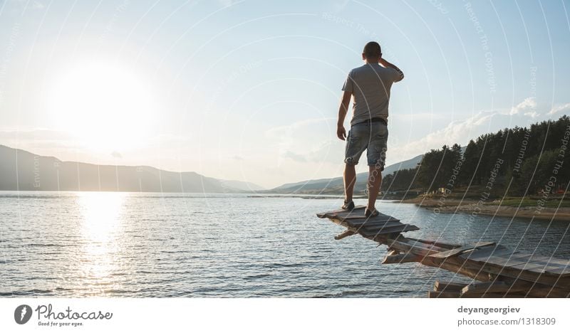 Young adult in front of mountain lake Lifestyle Happy Beautiful Relaxation Leisure and hobbies Vacation & Travel Tourism Adventure Camping Summer Mountain