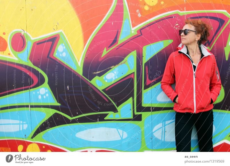 Woman in front of orange graffiti Style Design Life Fitness Sports Training Skater circuit Adults 1 Human being 30 - 45 years Art Work of art Youth culture