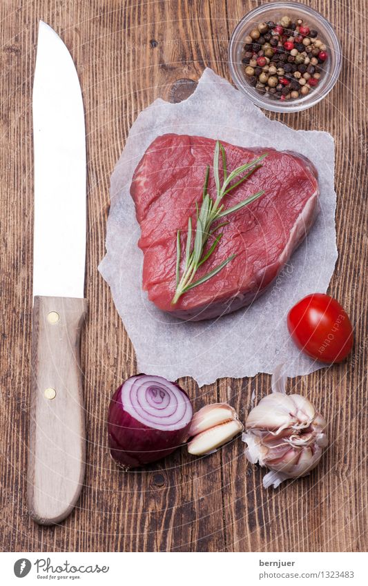steak Food Meat Vegetable Herbs and spices Eating Organic produce Knives Lie Good Uniqueness Red Authentic beef steak Steak Raw Onion Pepper Tomato Garlic
