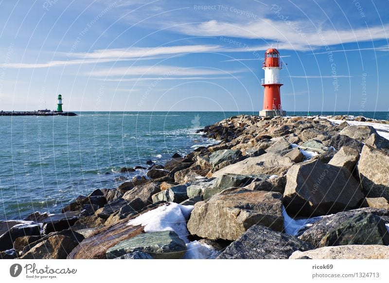Mole in winter Ocean Winter Nature Landscape Water Clouds Coast Baltic Sea Tower Lighthouse Architecture Landmark Stone Cold Blue Red White Vacation & Travel