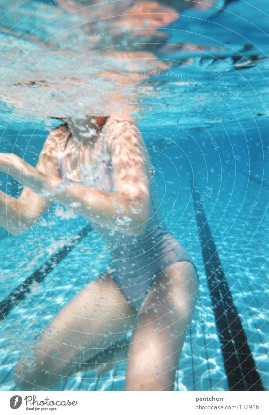 Underwater shot. Body of a slender young woman in a bathing suit in a swimming pool Underwater photo Joy Relaxation Summer Energy industry Feminine Woman Adults
