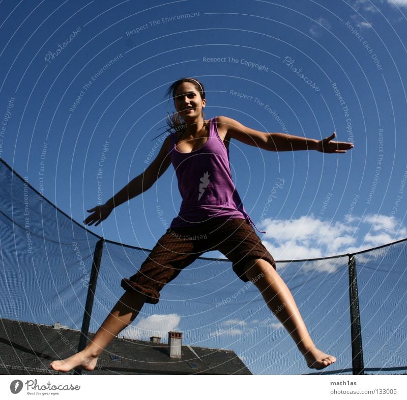 Cramped jumping jack woman Portrait photograph Jump Brown Woman Brunette Violet Trampoline Joy Hair and hairstyles Wind Sky Blue Flying hitchhike little bird