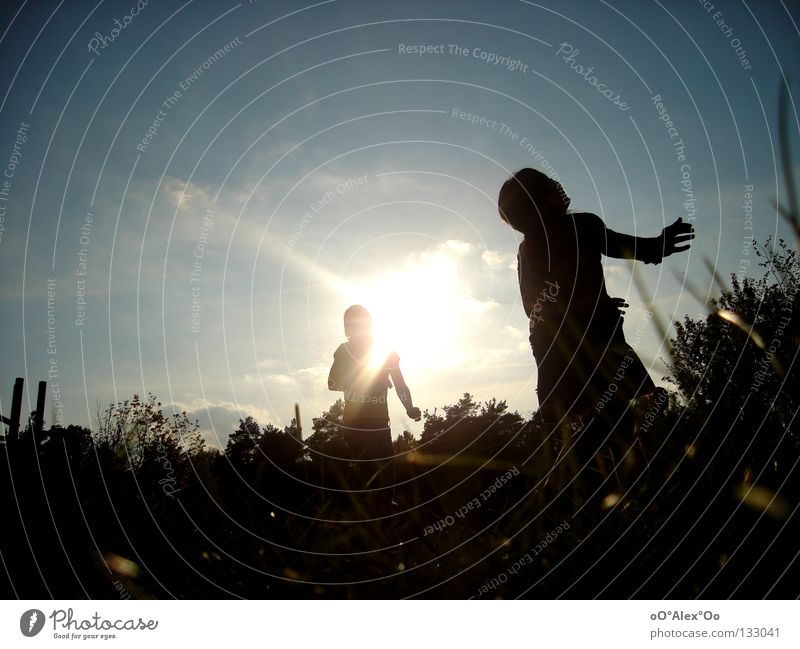 View upwards Joy Playing Child Human being Friendship Sky Grass Emotions Perspective Sunset Evening Light Looking