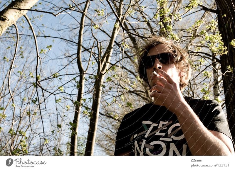 cool smoking Man Easygoing Masculine Eyeglasses Smoke Style T-shirt Human being Cool (slang) Rock music Hair and hairstyles sunglasses To hold on Nature