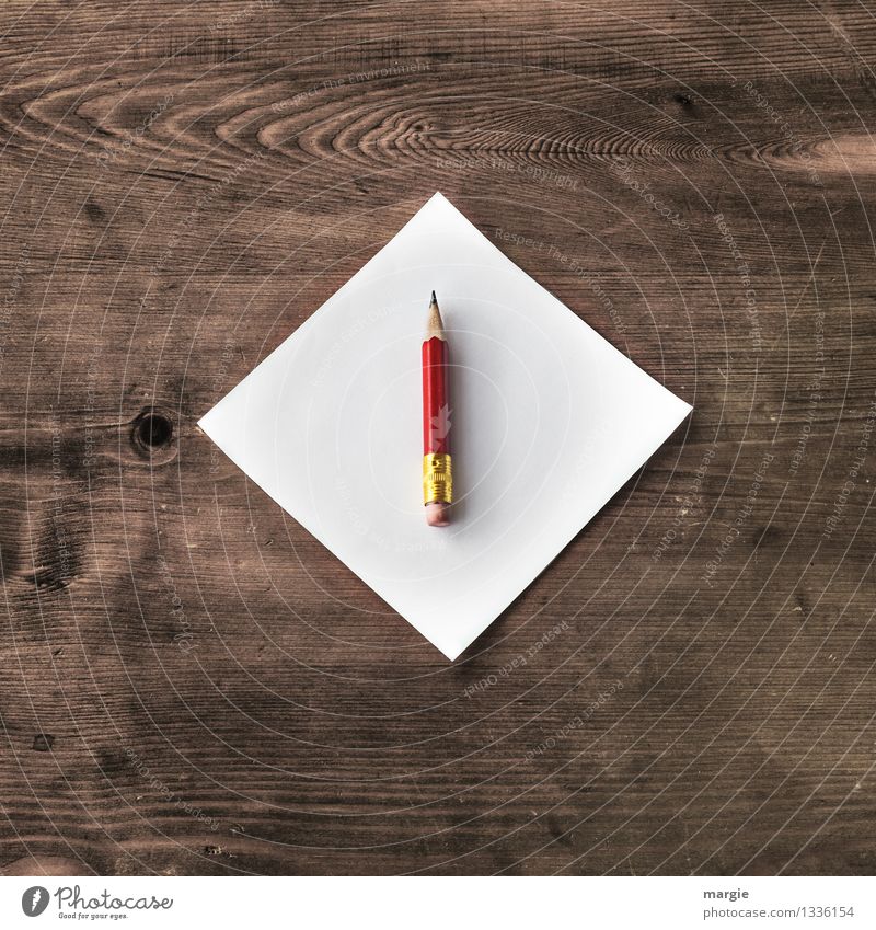 Writing utensils (notebook, pens, pencils, paper clips, paper, pencil  sharpener, buttons) on a wooden table. Frame from school utensils. Stock  Photo