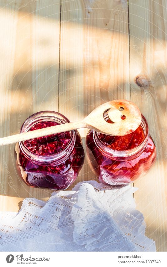 Homemade jam on wooden table Fruit Jam Breakfast Organic produce Spoon Summer Table Nature Fresh Delicious Natural Red Tradition food glass healthy Home-made