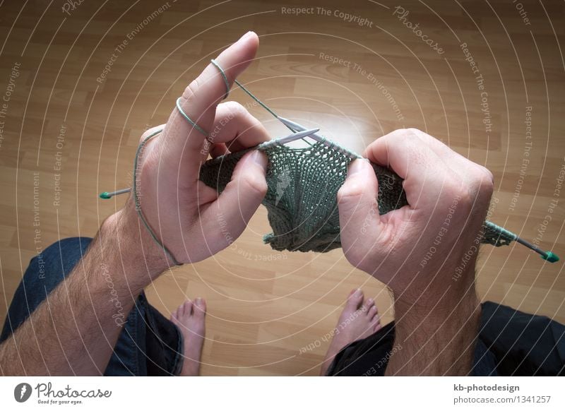 Closeup of a man knitting a green scarf at home Leisure and hobbies Winter Man Adults Hand 1 Human being Warmth Make wool Ball thread do it yourself DIY