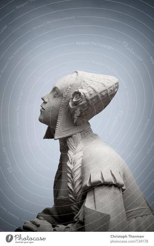 Heart Made Of Stone Statue Monument Granite Hard Cold Gray Woman Dress Costume Cap Headwear Light blue Motionless Historic Antique Ancient Holy Halo Belief