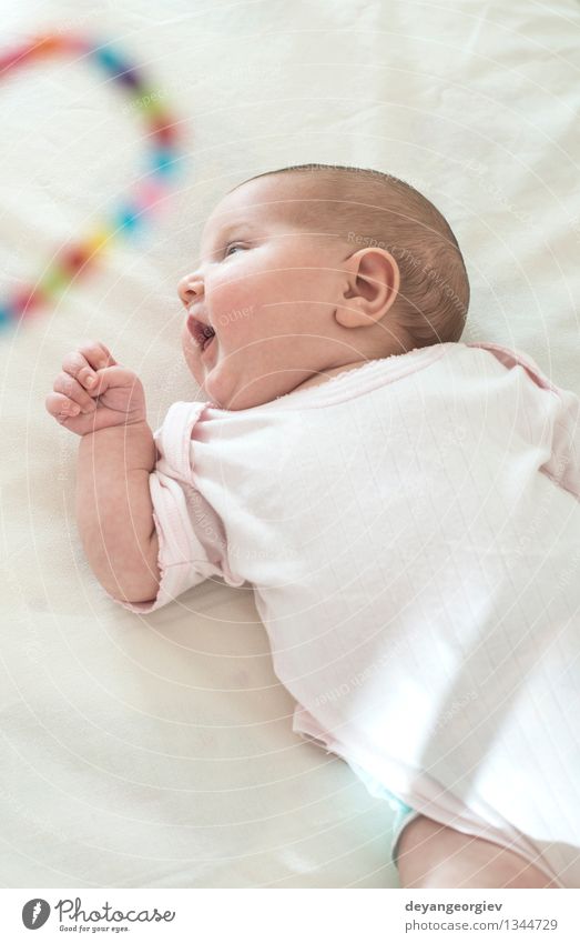 Baby in a baby bed. White clothes. Happy Face Life Child Girl Smiling Sleep Small Soft Newborn Lie (Untruth) Delightful Caucasian Home wndow sunshine