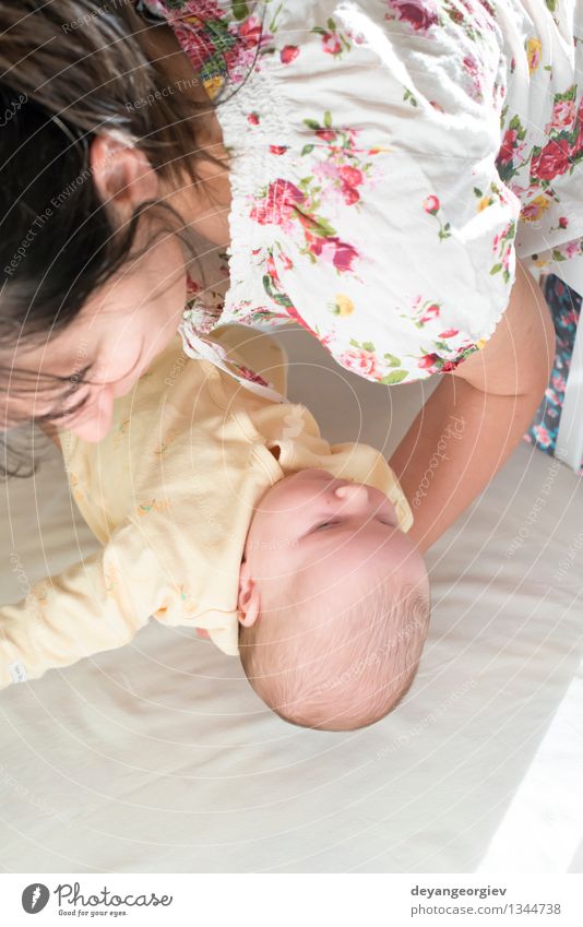 Baby in his mother's arms Happy Child Girl Woman Adults Mother Family & Relations Love Sleep Together Small New White Newborn Putt Crib young put Born care kid