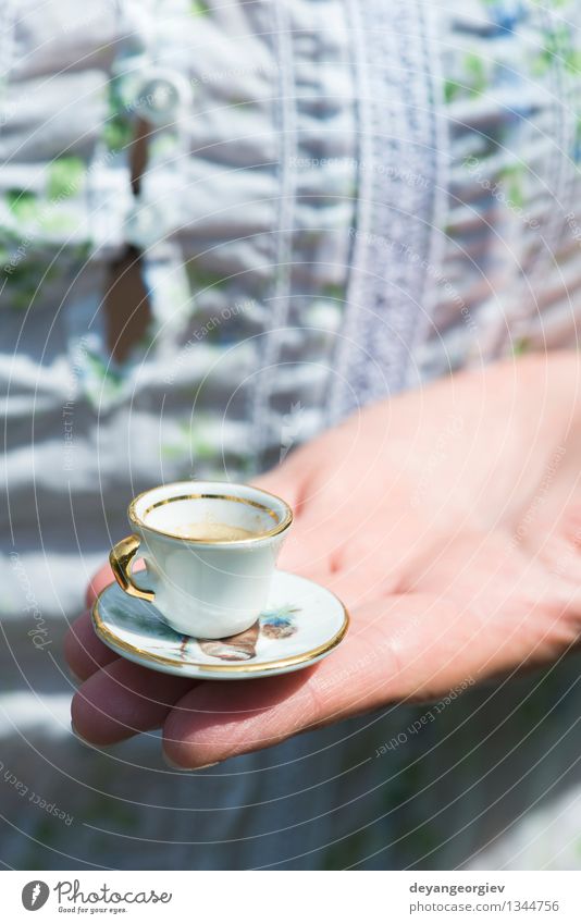 Hand hold very small cup of coffee Coffee Style Garden Table Woman Adults Old Hot Small Retro White Colour Miniature Café Hold overhead vintage Saucer people