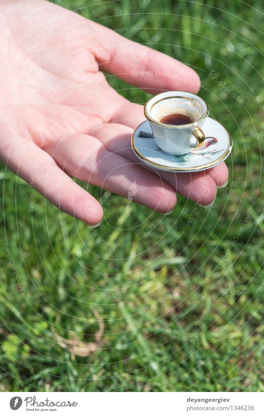 Hand Hold Very Small Cup Of Coffee. Miniature Cup Stock Photo, Picture and  Royalty Free Image. Image 45663617.