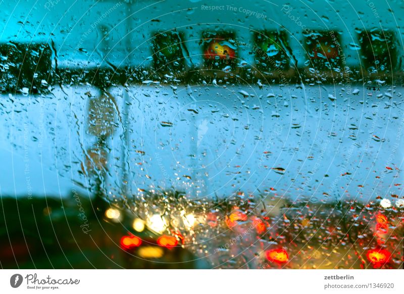 traffic jam Highway Rush hour Traffic jam Rain Rainwater Autumn Weather Windscreen Window Car Window Drops of water Light Floodlight Car headlights Rear light