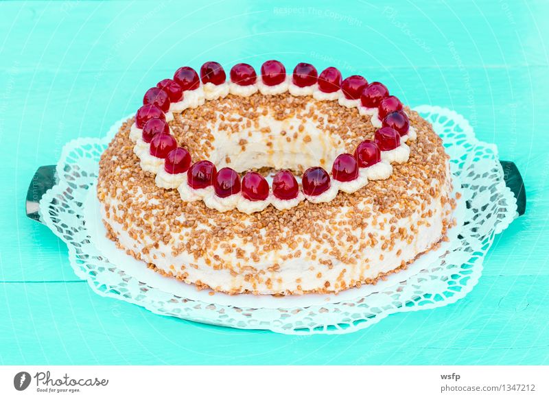 Frankfurt wreath with cherries on turquoise wood Cake Dessert Wood Turquoise frankfurt wreath butter cream cake annular Cherry foam pastries Cream Gateau