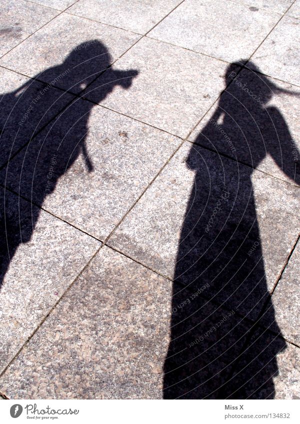 Fucking paparazzi. Colour photo Black & white photo Exterior shot Shadow Silhouette Human being Woman Adults Man Legs Street Gray Asphalt Stony In transit