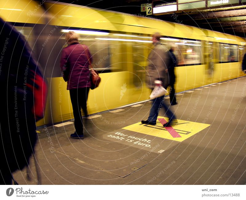 Berlin's fast subway Platform Railroad tracks Human being No smoking Transport yellow subway move Passenger