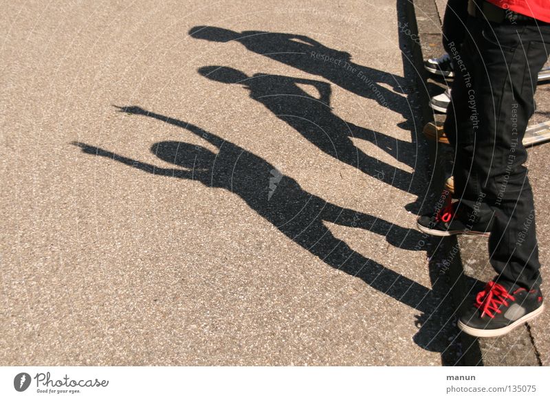 Shadowmen II Joy Leisure and hobbies Playing Child Family & Relations Infancy Youth (Young adults) Life Legs 3 Human being Group of children Street Asphalt Jump
