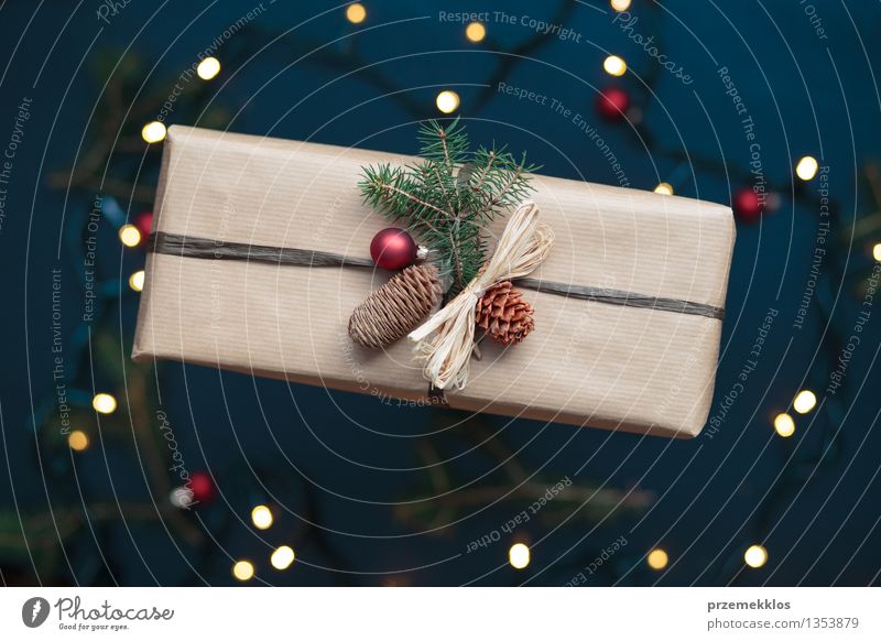 Wrapped Christmas present on the table Decoration Tradition December Gift Home Horizontal Pine Colour photo Interior shot Close-up Deserted Bird's-eye view Blur