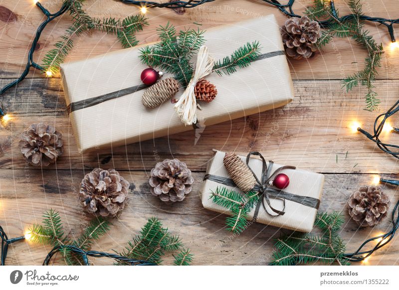 Wrapped Christmas presents on wooden floor Paper Package Box String Tradition Guest December Story Gift Home Horizontal Pine Colour photo Interior shot Close-up