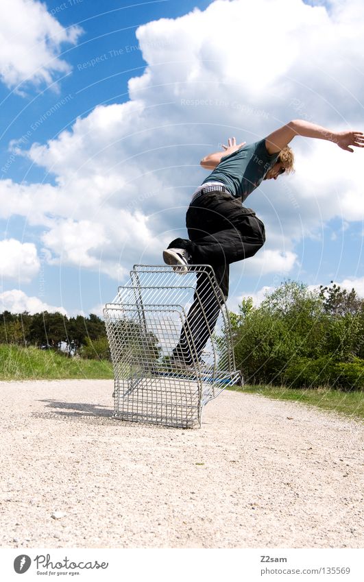 shopping surfer - take off Clouds Stand Contentment Shopping Trolley Cage Meadow Green Summer Juicy Physics Summery Man Masculine Action Dangerous Blonde