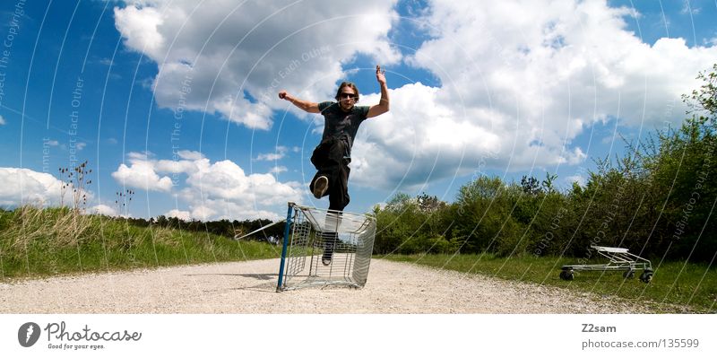 shopping surfer - flight Clouds Stand Contentment Shopping Trolley Cage Meadow Green Summer Juicy Physics Summery Man Masculine Action Dangerous Blonde