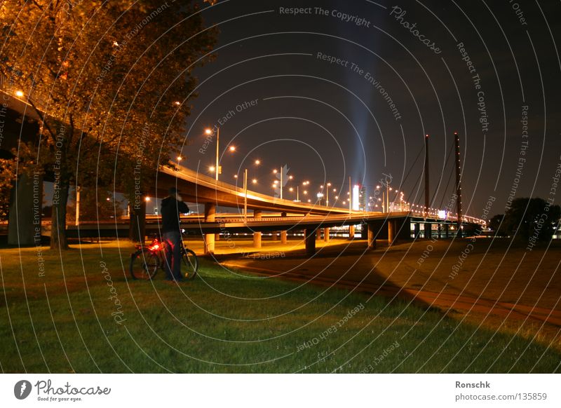 Far away Dark Town Meadow Bicycle Bridge Duesseldorf Rhine lonly