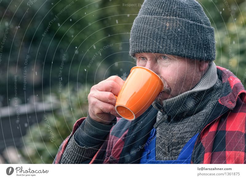 Man in knitted wool beanie drinking coffee Beverage Drinking Coffee Face Winter Snow Craftsperson Adults Weather Warmth Jacket Scarf Hat Hot Concentrate break