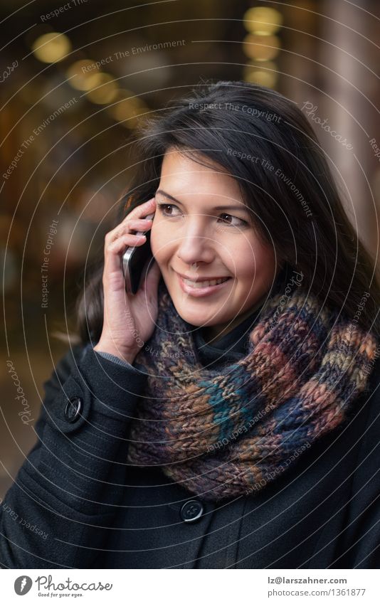 Smiling young woman with phone Lifestyle Happy Beautiful Face Winter To talk Telephone PDA Feminine Woman Adults 1 Human being 30 - 45 years Autumn Town Street
