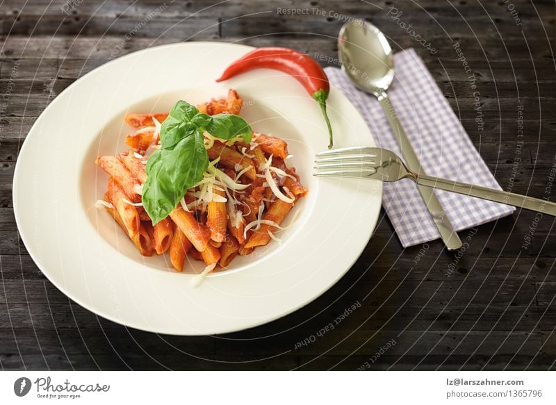 Plate of penne pasta with arrabiata sauce Cheese Herbs and spices Nutrition Lunch Fork Spoon Table Kitchen Restaurant Leaf Hot Delicious Tradition Food