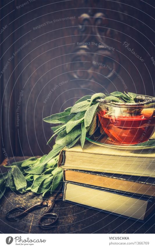 Herbs sage tea on pile of books and old scissors Organic produce Vegetarian diet Diet Beverage Hot drink Tea Cup Lifestyle Style Design Healthy