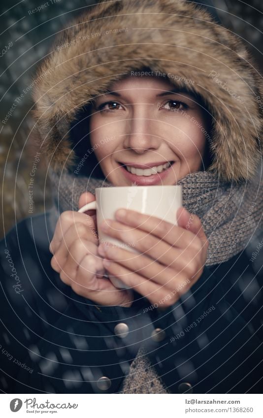 Young woman holding warm cup of tea Soup Stew Beverage Drinking Coffee Tea Lifestyle Happy Face Winter Snow Woman Adults 1 Human being 30 - 45 years Weather