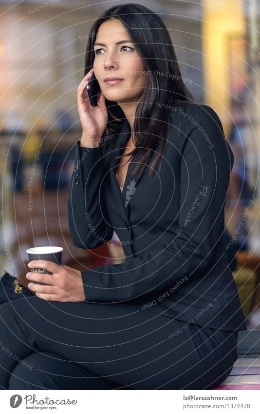 Smiling Businesswoman Listening on Mobile Phone Coffee Face Telephone Technology Woman Adults Brunette Paper Sit Wait Self-confident attractive break chatting