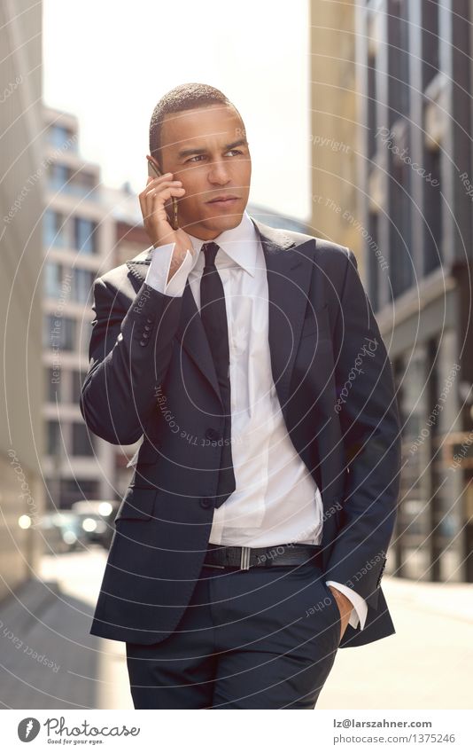 Young Businessman Talking on Phone In the Street Lifestyle Style Calm Success To talk Telephone PDA Technology Man Adults Town Fashion Listening Stand
