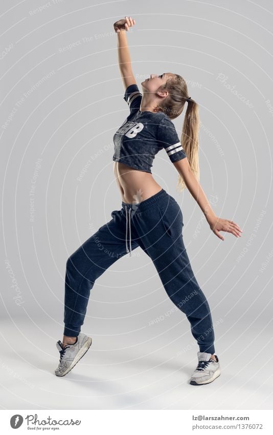 Female Hip Hop Dancer in Tiptoe Position Entertainment Woman Adults Ballet Culture Blonde Thin agile athletic attractive balanced dancing Practice fit healthy
