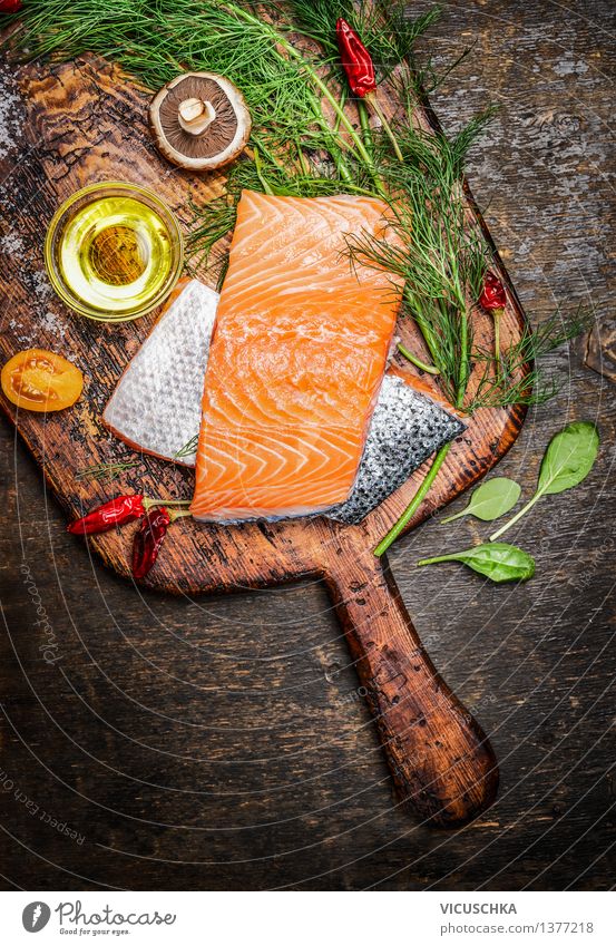 Salmon fillet on old cutting board with oil, herbs and spices Food Fish Herbs and spices Cooking oil Nutrition Lunch Dinner Banquet Organic produce