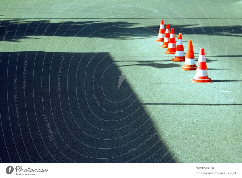 pylons Hat Traffic cone Road traffic Diversion Rule Road sign Behind one another Reddish white Asphalt Summer Traffic infrastructure Communicate Street sign