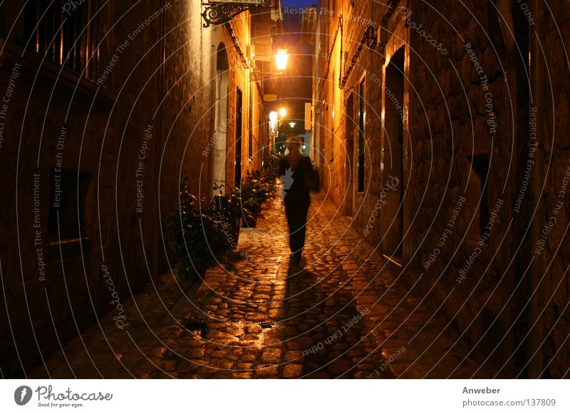 Woman at night alone on the road in Gasse in Soller, Mallorca Night In transit Alley Majorca Spain Vacation & Travel Narrow Dark Dangerous Romance Going