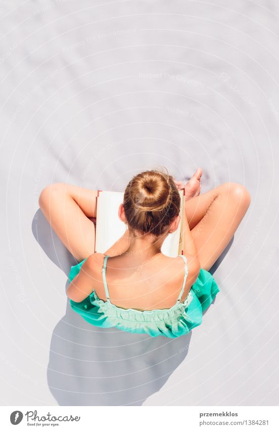 Girl reading a book on a sunny day Reading Summer Child Study Human being Youth (Young adults) 1 8 - 13 years Infancy Book background education teenager young