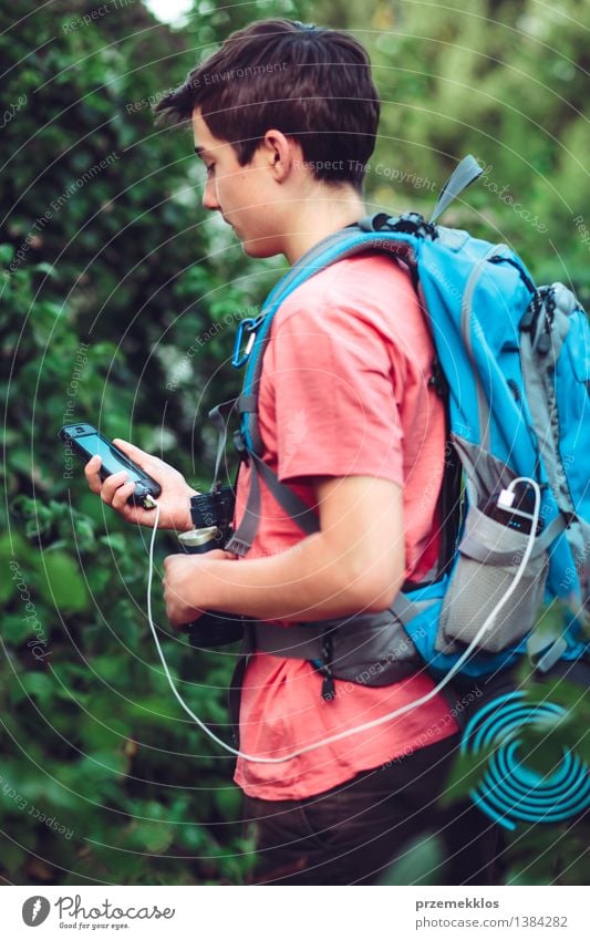 Boy charging mobile phone during the journey Vacation & Travel Trip Adventure Summer Summer vacation Hiking Financial institution Cellphone Boy (child)