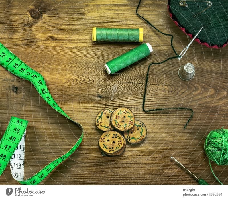 Threaded green: Sewing equipment, such as needle, tape measure