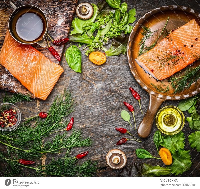 Salmon fillet on a rustic kitchen table with fresh ingredients Food Fish Vegetable Lettuce Salad Herbs and spices Cooking oil Nutrition Lunch Dinner Banquet
