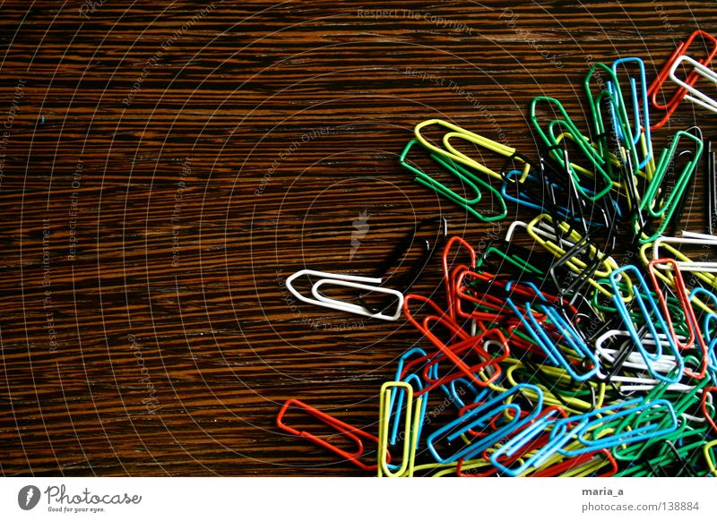 klammerkrams l Paper clip Chaos Muddled Multicoloured Wood Yellow White Reddish black Green Flexible Wire Attachment paperclip chaos Wood grain