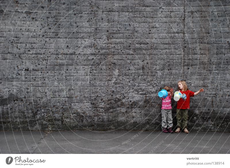 stage free II Girl Boiler Child Playing Shows Toys Wall (building) Concrete To talk Small Summer Gray Stand Smart Authentic Beautiful Joy Human being Sand