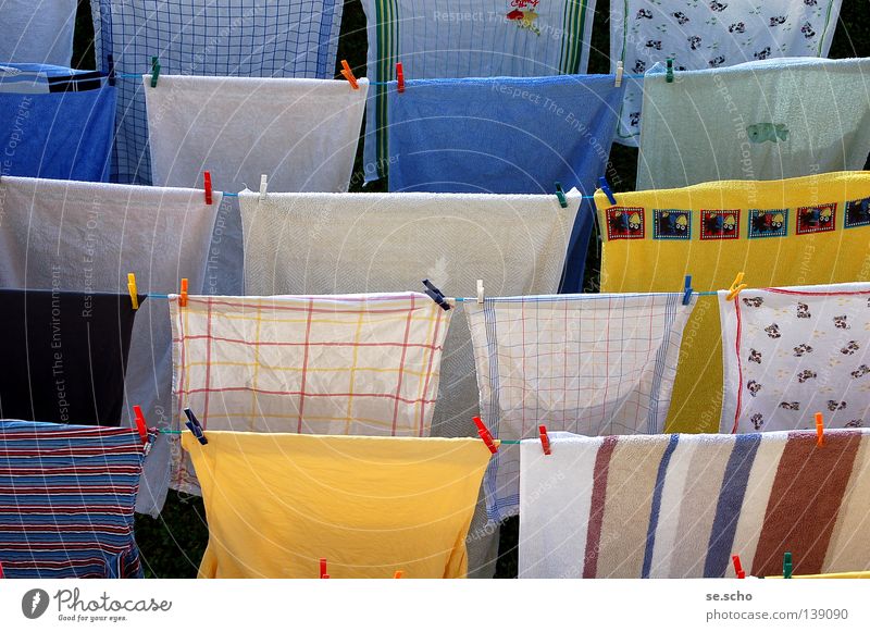 Laundry drying on the rope - a Royalty Free Stock Photo from Photocase