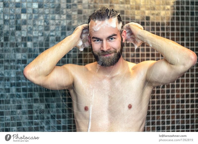 Bearded man washing his hair Lifestyle Personal hygiene Skin Health care Medical treatment Bathroom Man Adults Hair Smiling Friendliness Naked Clean at camera