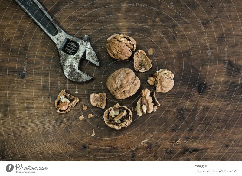 Brute force: closed and opened walnuts with a wrench Nutrition Leisure and hobbies Christmas & Advent Tool Technology Nutcrackers Nutshell Walnut Wood Metal