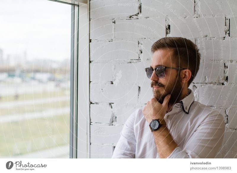 Bearded man in sunglasses looking at the window Lifestyle Elegant Style Hair and hairstyles Face Human being Masculine Man Adults Fashion Shirt Sunglasses